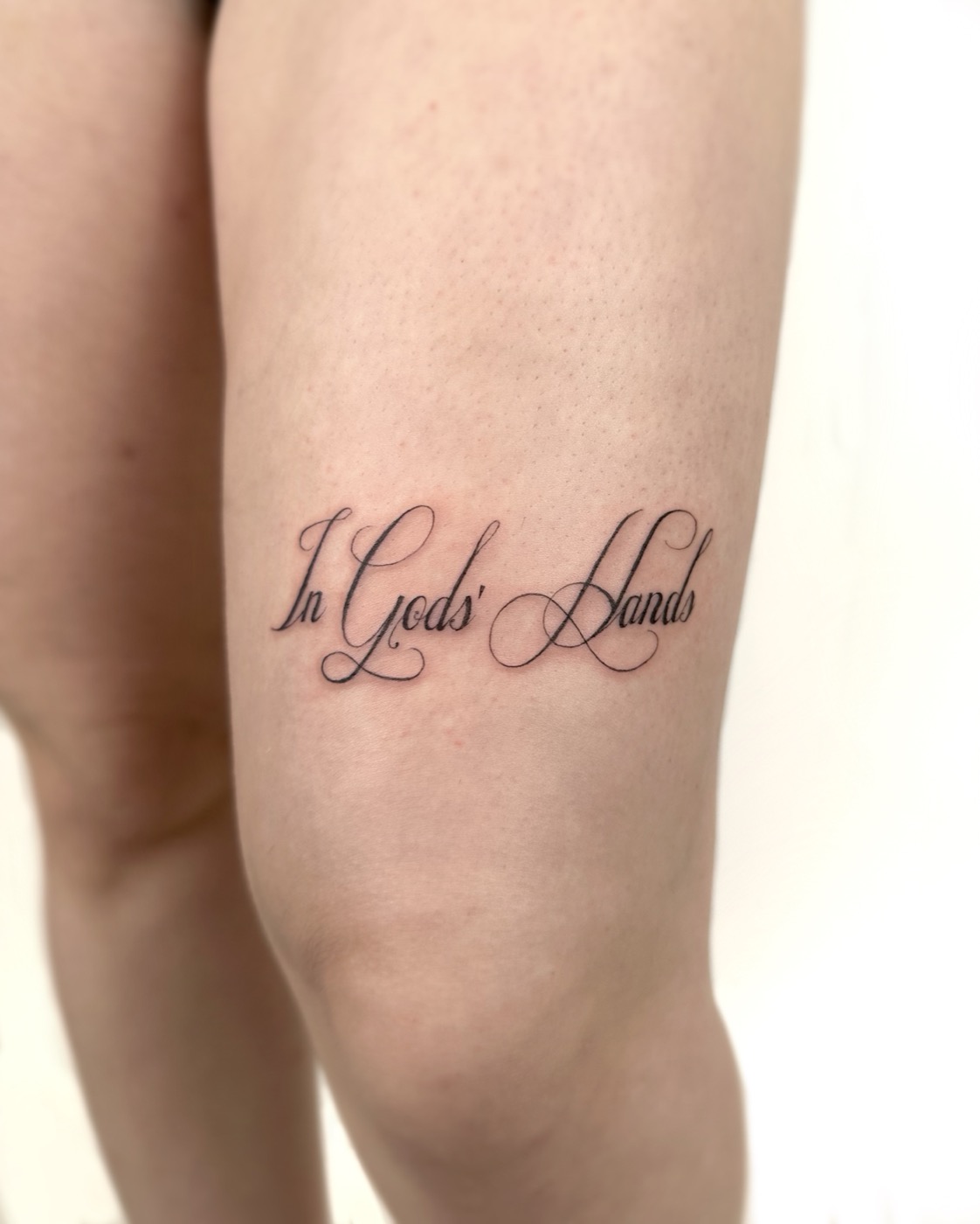 In Gods' Hands fine-line script (thigh)