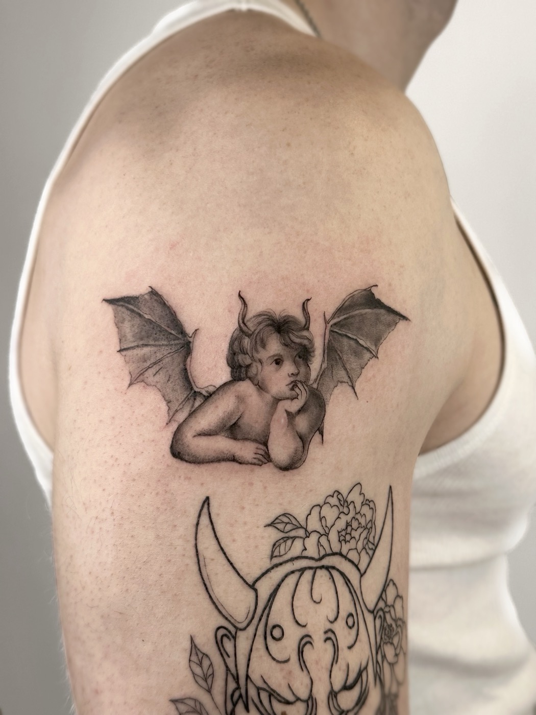 Cherub with bat wings, Raphael-style (shoulder)