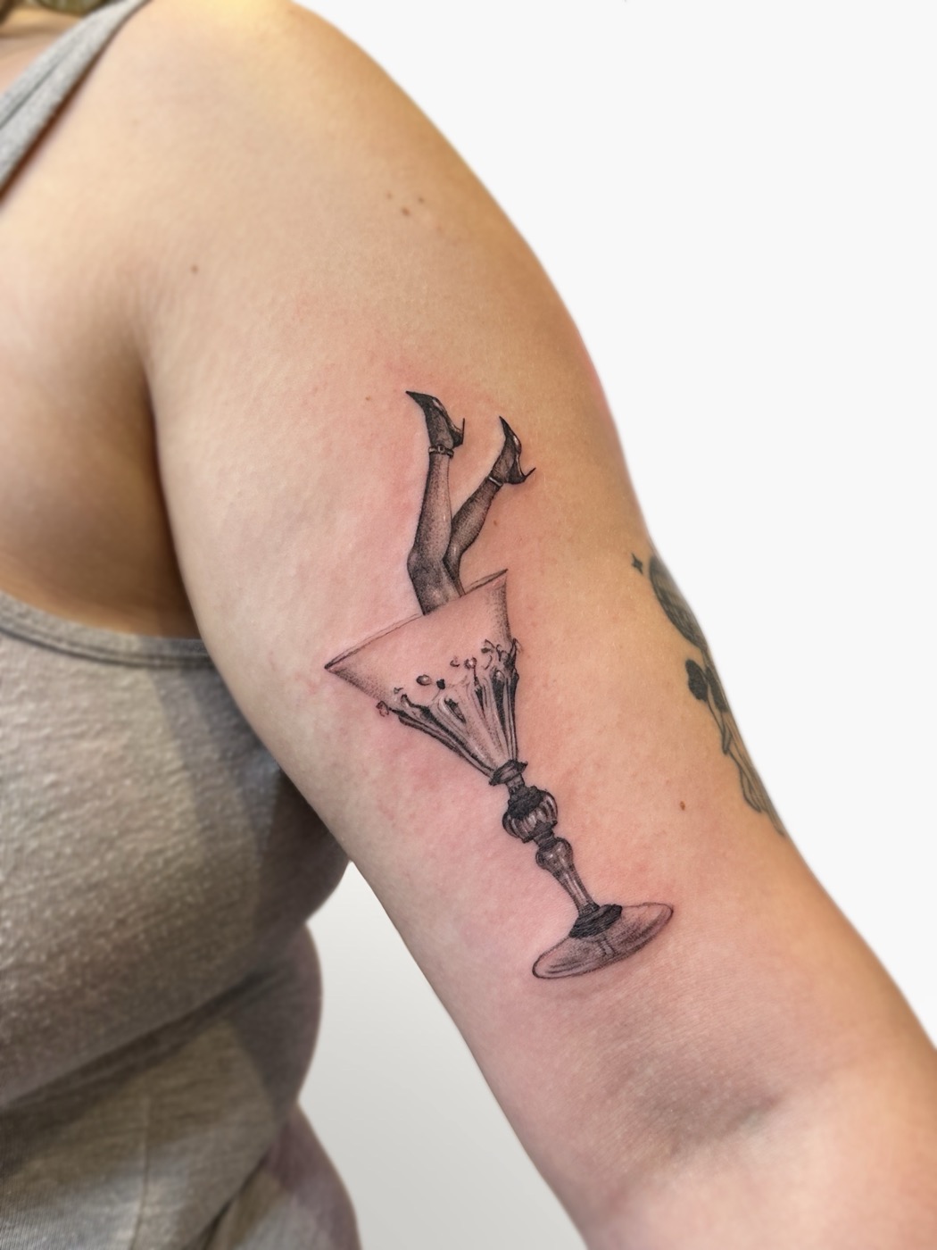 Surreal martini glass with legs (arm)