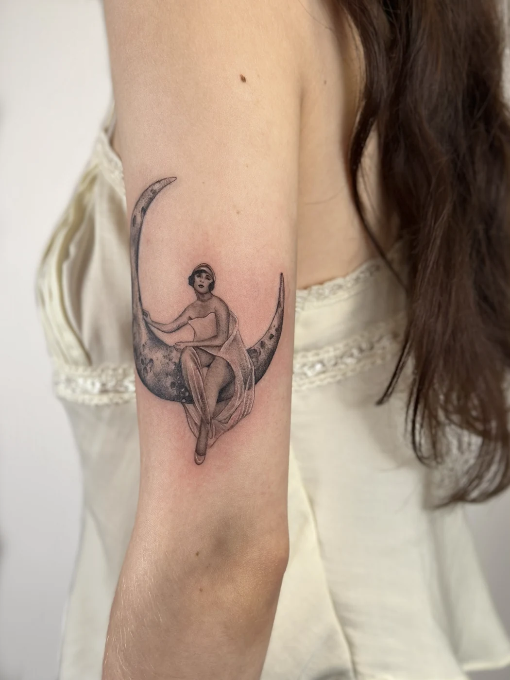 Art deco woman on crescent moon (upper arm)